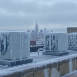 Rooftop VRF outdoor condenser units in winter ice on a Manhattan commercial building